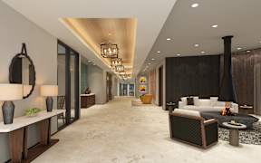 A modern living room with a fireplace and a long hallway.