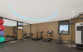A gym with treadmills, exercise bikes, and a television.