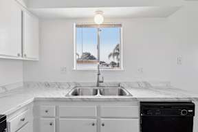 Kitchen with window at Ocean Villas Apartments, Oxnard