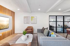 Living area with TV at Ocean Villas Apartments, Oxnard, CA 