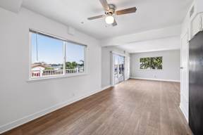 Living room with ceiling fan at Ocean Villas Apartments, Oxnard