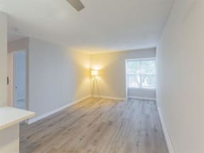 an empty living room with wood floors and a window  at Skyline Heights LLC, Daly City