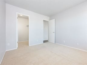 an empty living room with white walls and a closet  at Skyline Heights LLC, Daly City