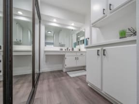 a bathroom with a sink and a mirror and a shower  at The Resort at Encinitas Luxury Apartment Homes, Encinitas, 92024