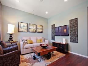 a living room with a couch and a table at The Vines at Riverpark, LLC, Oxnard, 93036