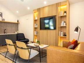 a living room with a couch and chairs and a television at Parc Medallion LLC, Union City California