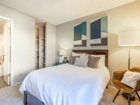 a bedroom with a white bed and a closet at Parc Medallion LLC, California, 94587