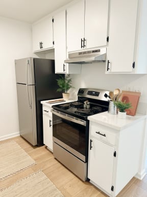 kitchen with white cabinets and stainless steel appliances at Mission Valley, San Diego, 92120