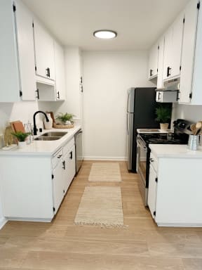 kitchen with white cabinets at Mission Valley, San Diego