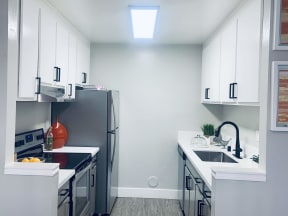Kitchen with white cabinets at Parc Medallion Apartments, Union City, 94587