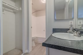 a bathroom with a sink and a toilet at City View Apartments at Warner Center, Woodland Hills, CA 91367