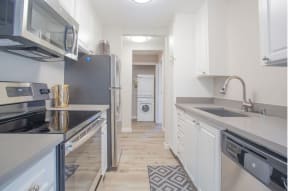 a kitchen with white cabinets and stainless steel appliances at Sunnyvale Crossings Apartments, LLC, Sunnyvale, CA 94087