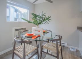 a dining room with a glass table and chairs at Sunnyvale Crossings Apartments, LLC, California, 94087