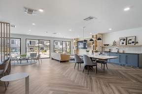 A modern open plan living and dining area with a kitchen at Latitude Apartments at Mission Valley Apartments, California