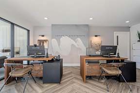 A modern home office with a wooden desk and two chairs at Latitude Apartments at Mission Valley Apartments, California, 92120