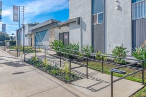 a building with stairs and plants in front of itat BLVD Apartments LLC, California