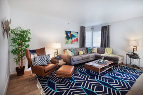 furnished living room with couches and chairs at the adelaideelaide apartmentsat The Bryant, Yorba Linda, 92887
