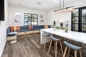 a living room with a couch and a kitchen with a table and chairs at La Jolla Blue, San Diego, CA