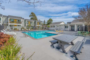a swimming pool with a picnic table and chairs around it at Napa Green Apartments LLC, Napa, CA 