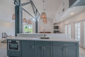 a large kitchen with blue cabinets and a white counter top at Napa Green Apartments LLC, Napa