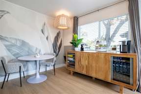 A modern dining area with a round table and chairs.at Summerhill Place Apartments, Union City, CA