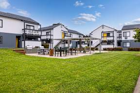 Courtyard With Bbq Area And Lush Gardens at The Gates at the Marina Apartments, Marina, CA