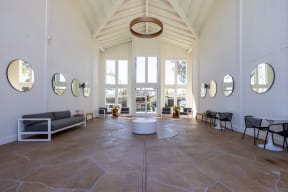 the lobby of a building with tall ceilings and large windows at Campbell West Apartments, Campbell