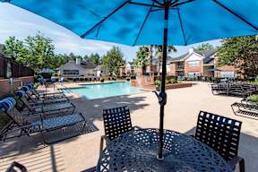 our apartments offer a swimming pool with chairs and umbrellas