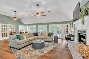 a living room with a large couch and a fireplace