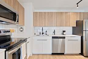 a kitchen with a sink and a refrigerator