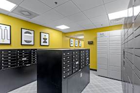 a view of a locker room with lockers and a yellow wall