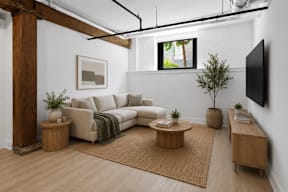 A living room with a white couch and a brown rug.