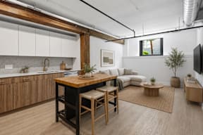 A modern kitchen with wooden cabinets and a large island.