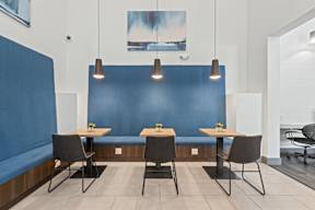 A blue booth with a table and chairs in front of it at The Preserve at Preston Trails Apartments, Texas, 75104