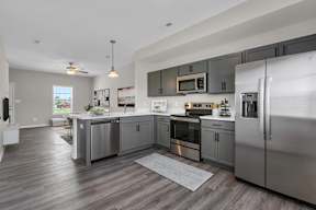 Kitchen with stainless steel appliances at Arrowood Farms, Clarksville, TN, 37042