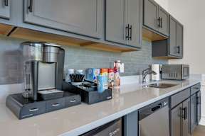 A kitchen with a coffee maker and a microwave on the counter.at Arrowood Farms, Tennessee, 37042