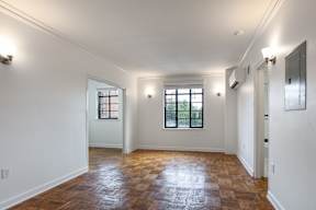 Bedroom with a wooden floor and two windows  at Marleigh apartments located in Indianapolis, IN