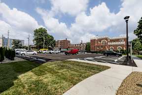 A parking lot with uncovered parking available  at Marleigh apartments located in Indianapolis, IN