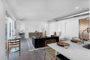 a living room with a couch and a dining table