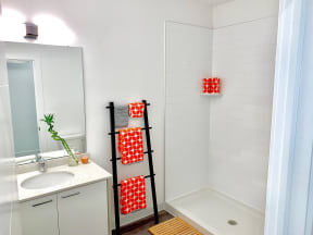 a small bathroom with a shower and a sink