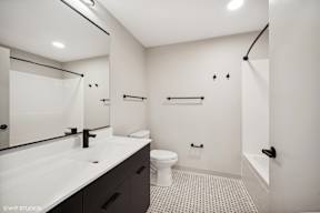 Harbourline Apartments, St Paul a bathroom with a sink toilet and a shower