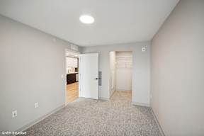 Harbourline Apartments, St Paul a bedroom with a closet and a door to a bathroom