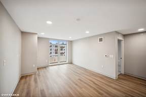Harbourline Apartments, St Paul an empty living room with wood floors and white walls