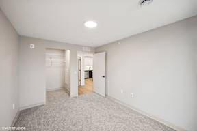 Harbourline Apartments, St Paul a spacious bedroom with a closet and a bathroom