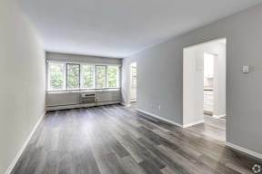 A room with a window and a door.