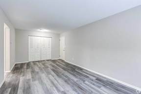 A room with a grey floor and white walls.