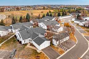 A bird's eye view of a residential area with houses and trees.