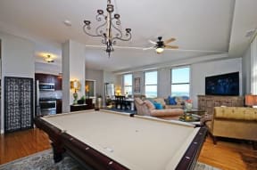 a pool table sitting in the middle of a living room