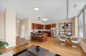 an open kitchen and dining room with a table and chairs