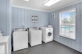 A laundry room with a washer and dryer in it.
